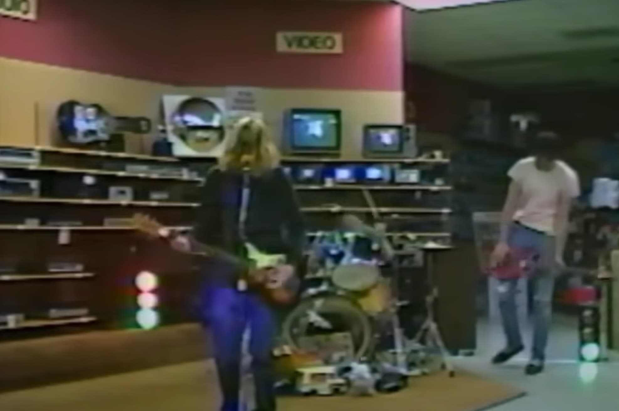 Nirvana rocks out in the Audio/Video section of the electronics retailer, circa 1989. 

